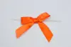 2-1/2" X 2" SATIN ORANGE PRE-TIED BOW CLEAR TWIST TIE