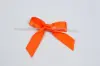 2-1/2" X 2" SATIN ORANGE PRE-TIED BOW CLEAR TWIST TIE